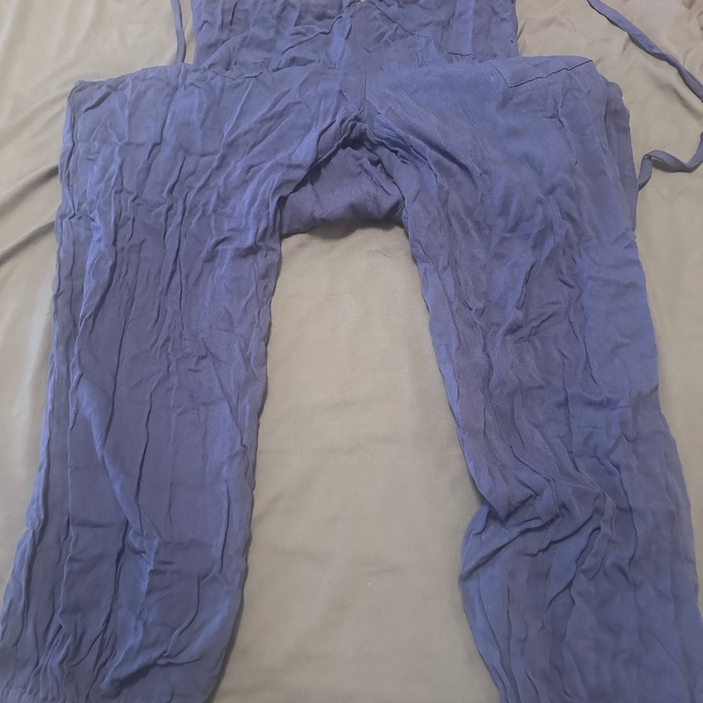 Brand new one piece jumpsuit that ties around neck